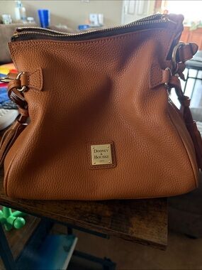Dooney & Bourke Pebble Grain Leather Tassel Shoulder Bag in Caramel.